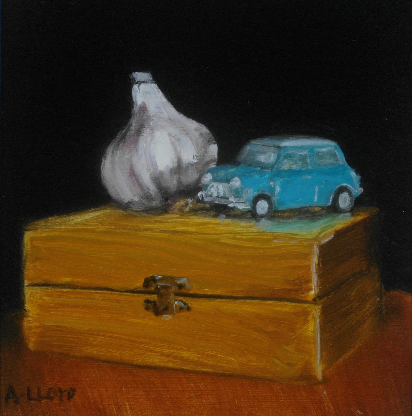 Toy Mini and Garlic on a Wooden Box